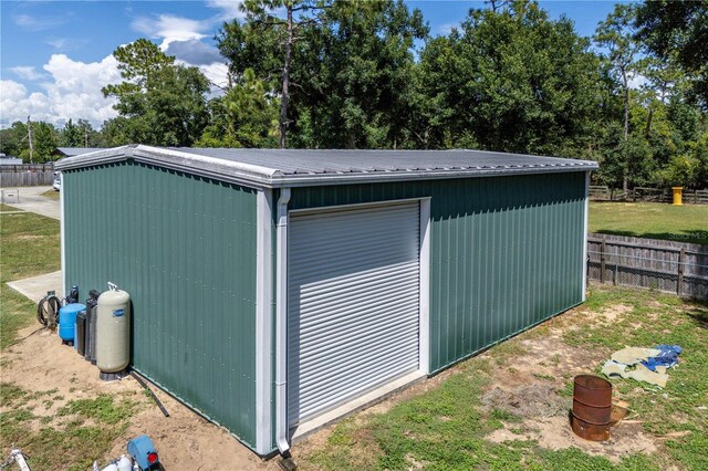 19402 E 5th St, Umatilla, FL 32784 - view of outdoor structure featuring fence and an outdoor structure