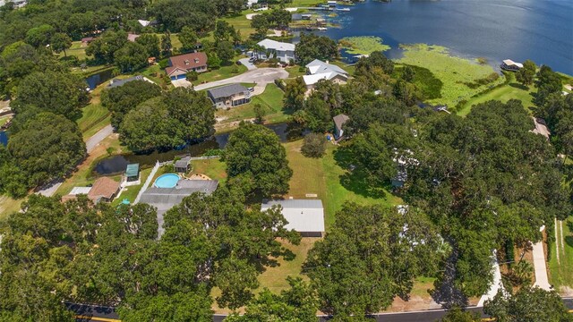 drone / aerial view featuring a residential view and a water view