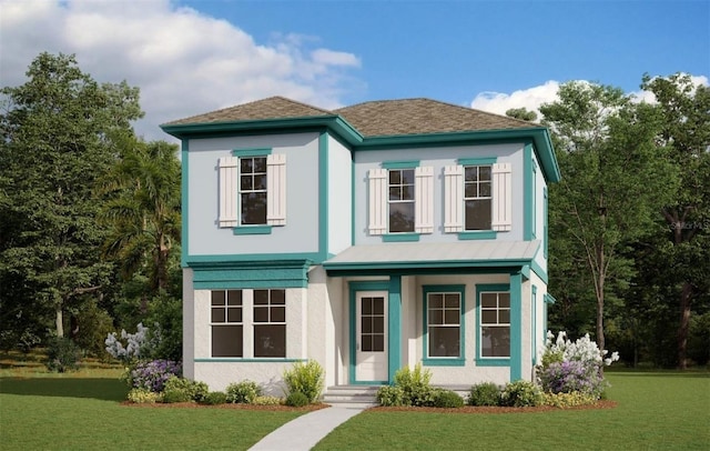 view of front of home featuring a front yard and stucco siding