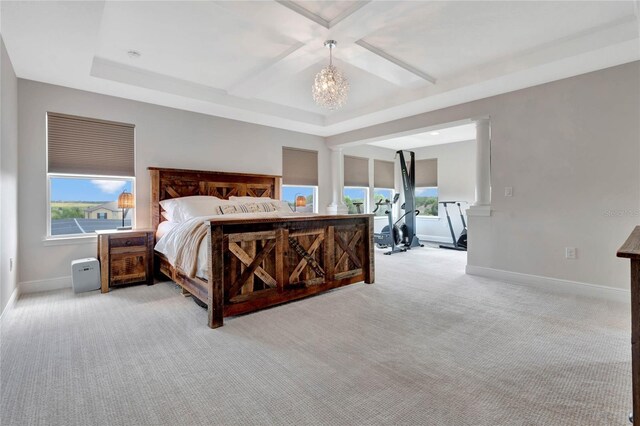 bedroom featuring coffered ceiling, light colored carpet, a raised ceiling, and a notable chandelier