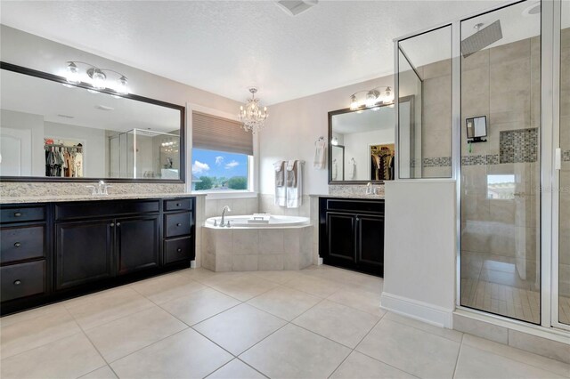 bathroom with vanity, independent shower and bath, and tile patterned floors