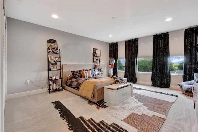 bedroom with recessed lighting, baseboards, and light colored carpet