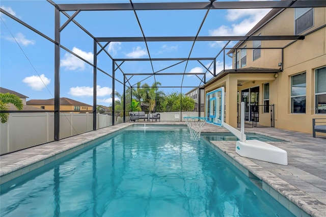 view of swimming pool featuring a patio area, a lanai, and a fenced in pool