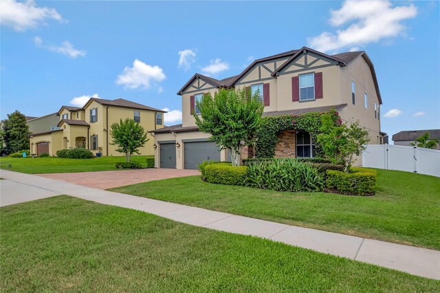 view of front of home featuring a garage and a front yard