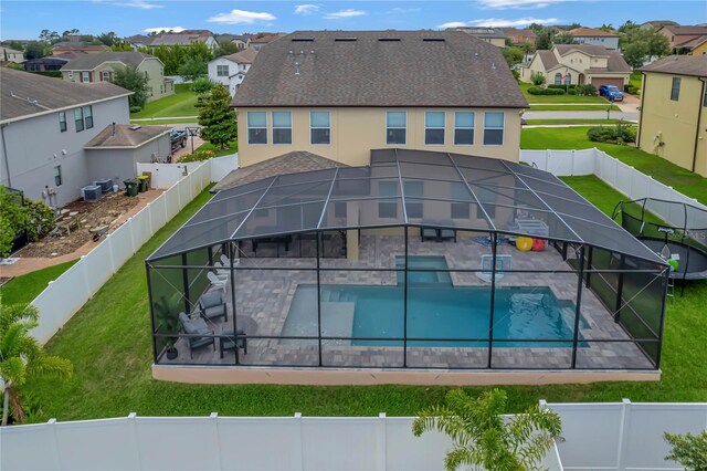 view of pool with a yard