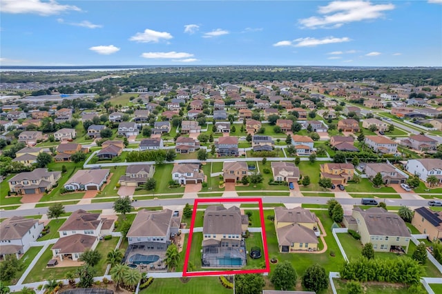 birds eye view of property with a residential view