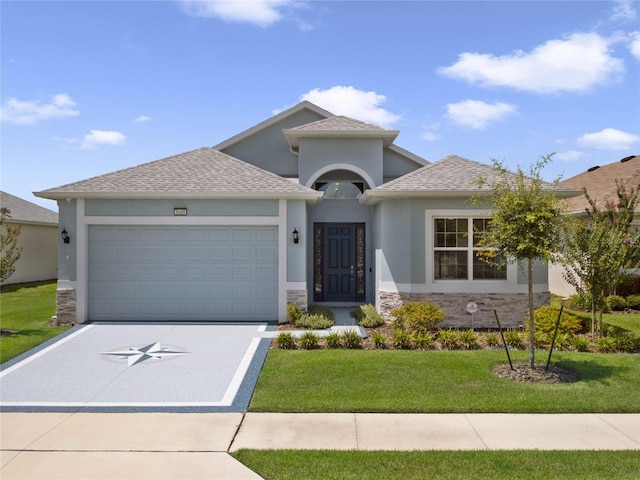 view of front of property with a front lawn and a garage