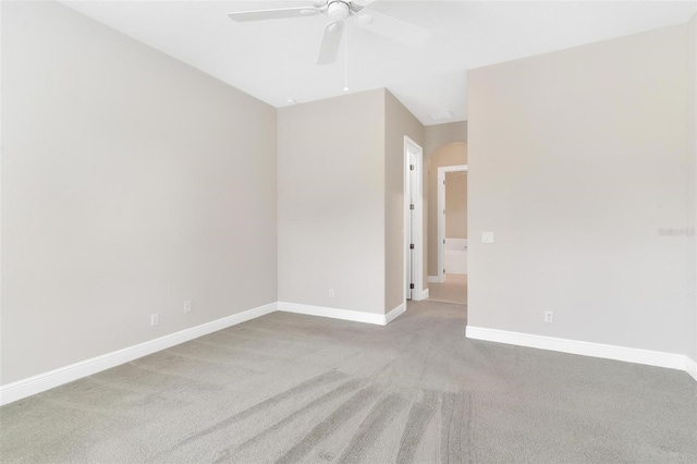 carpeted empty room featuring ceiling fan