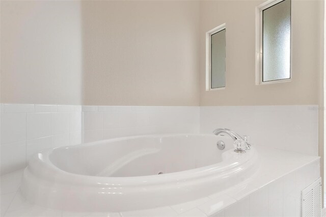 bathroom featuring a tub