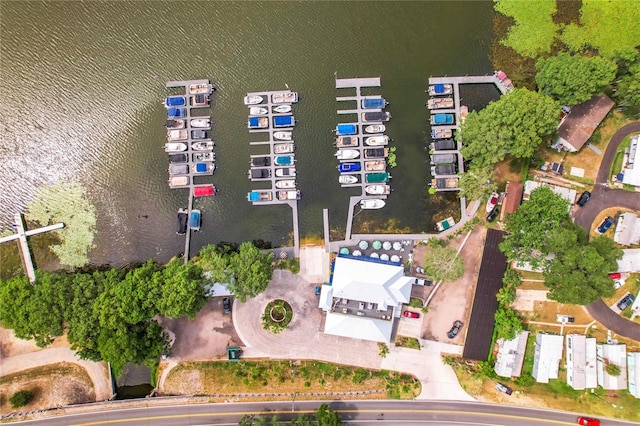 birds eye view of property with a water view