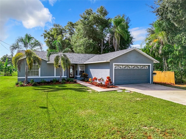 single story home featuring a front yard and a garage