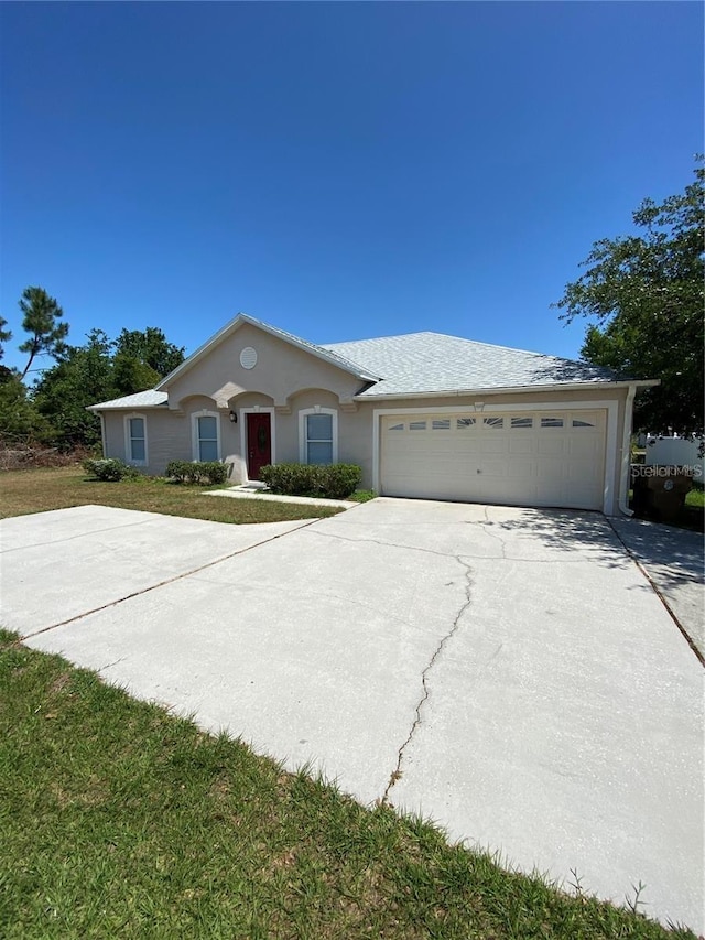 single story home with a garage