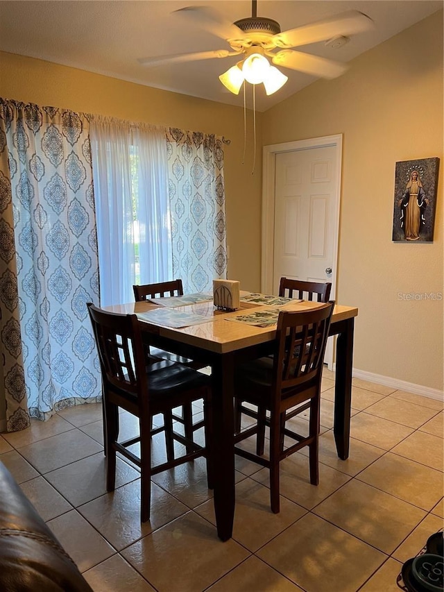 tiled dining room with ceiling fan