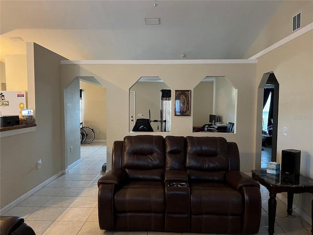 living room featuring vaulted ceiling and light tile patterned flooring