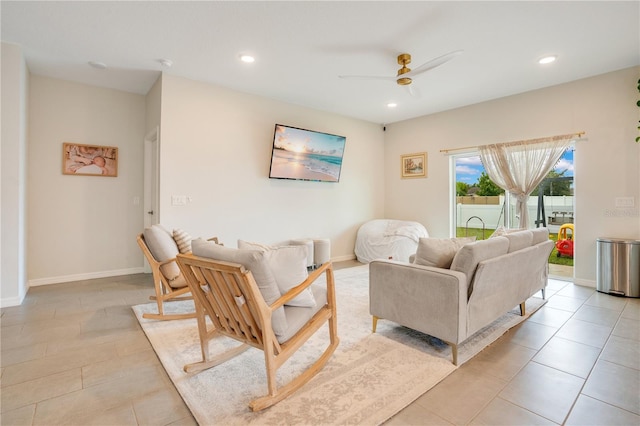 living room featuring light tile patterned flooring and ceiling fan