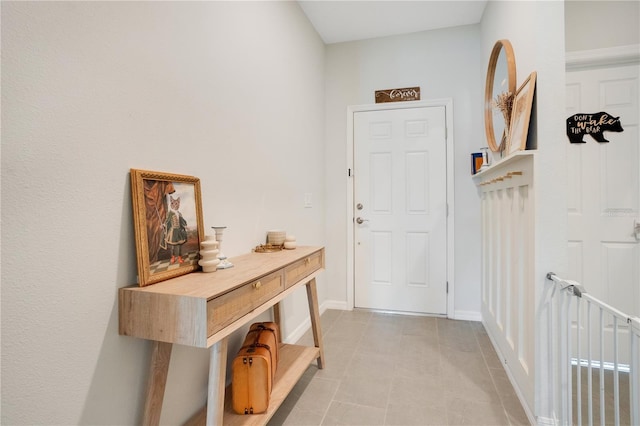 doorway featuring light tile patterned floors