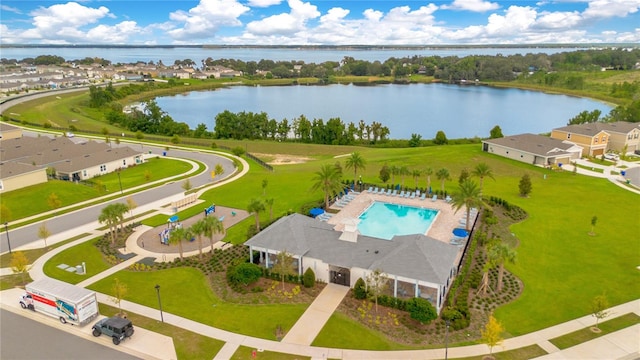 birds eye view of property with a water view