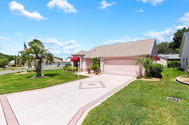 view of front of house with a garage, driveway, a front lawn, and stucco siding