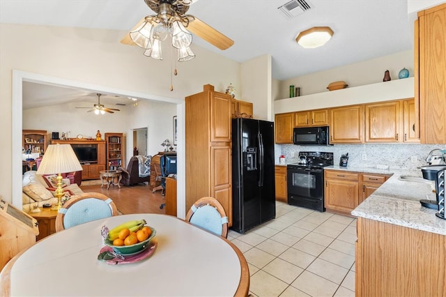 kitchen with light tile patterned floors, black appliances, ceiling fan, decorative backsplash, and lofted ceiling