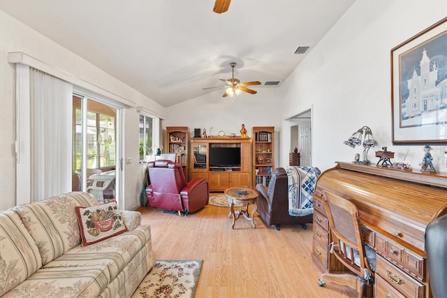 living area with light wood-style floors, lofted ceiling, visible vents, and ceiling fan