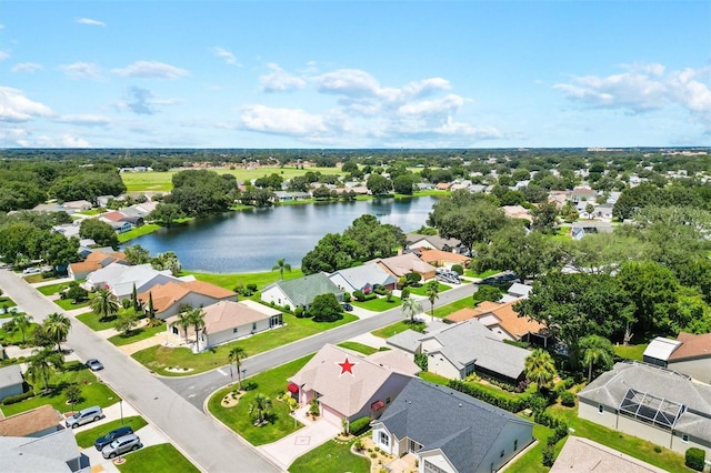 birds eye view of property featuring a water view and a residential view