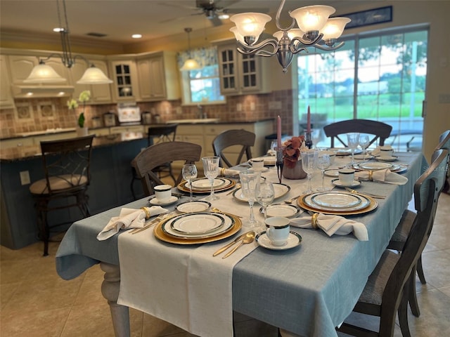 dining space featuring light tile patterned floors and ceiling fan with notable chandelier