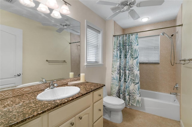 full bathroom with ceiling fan, shower / bath combo, tile patterned floors, toilet, and vanity