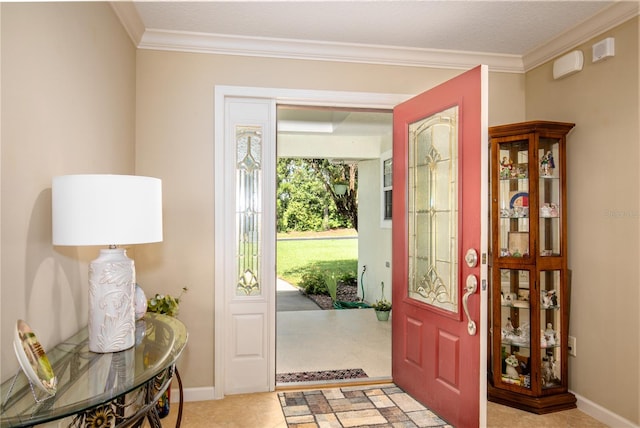 entrance foyer featuring light tile patterned floors and crown molding