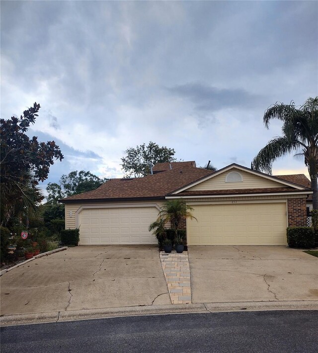 single story home featuring a garage