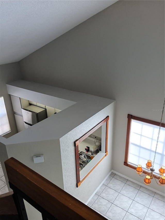 details with a notable chandelier and baseboards