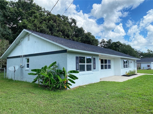 exterior space with a yard