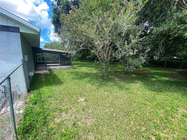 view of yard featuring a sunroom