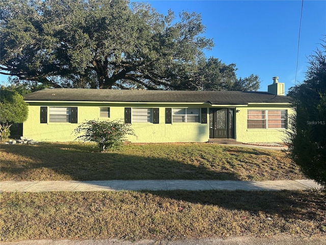 single story home with a front yard