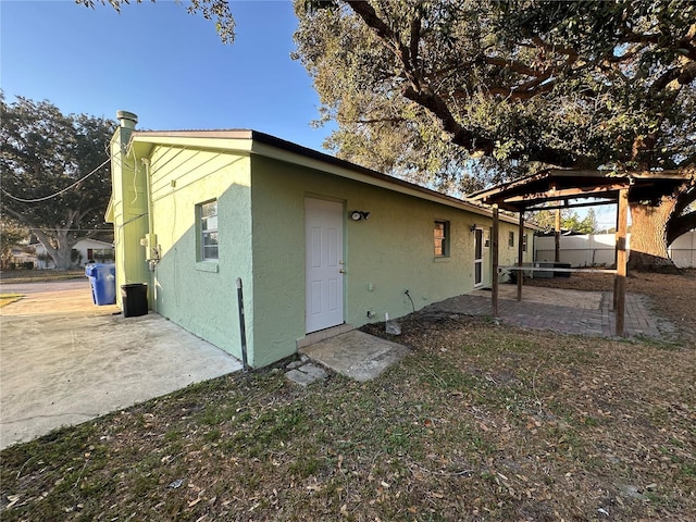 back of house with a patio