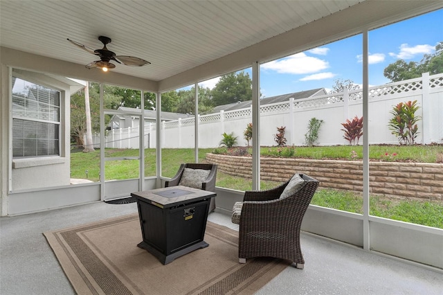 sunroom / solarium with a wealth of natural light and ceiling fan