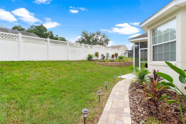 view of yard featuring a sunroom