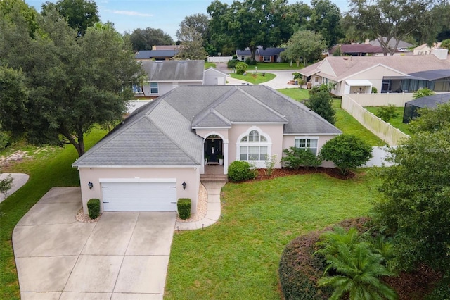 ranch-style home with a garage and a front lawn