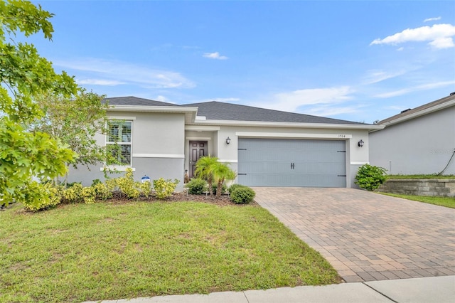 view of front facade with a garage and a front yard