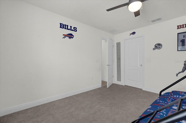 unfurnished bedroom featuring carpet and ceiling fan