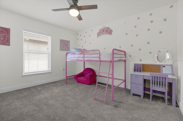 bedroom featuring carpet flooring, a crib, and ceiling fan