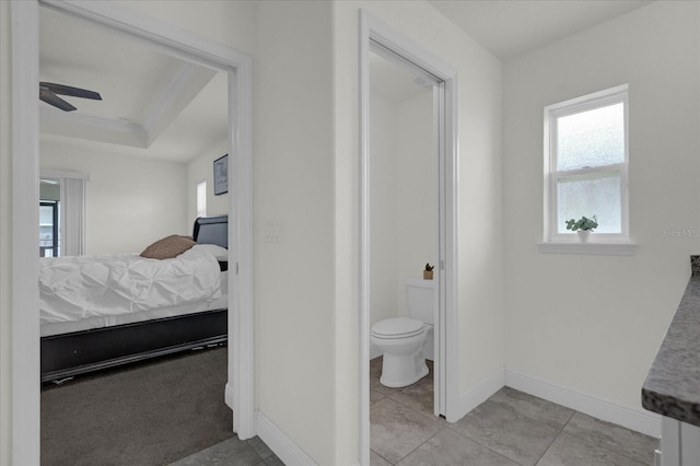 bathroom with tile patterned floors, vanity, toilet, and ceiling fan