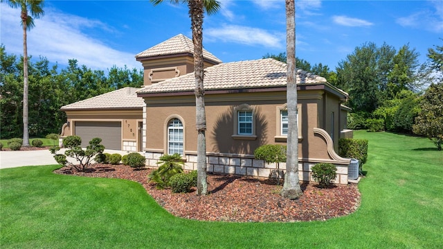 view of front facade featuring driveway, a tile roof, an attached garage, a front yard, and stucco siding