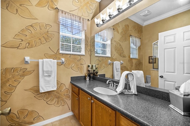 bathroom featuring tile patterned flooring, vanity, toilet, and ornamental molding