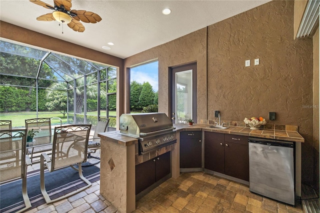 view of patio featuring ceiling fan, area for grilling, and a lanai