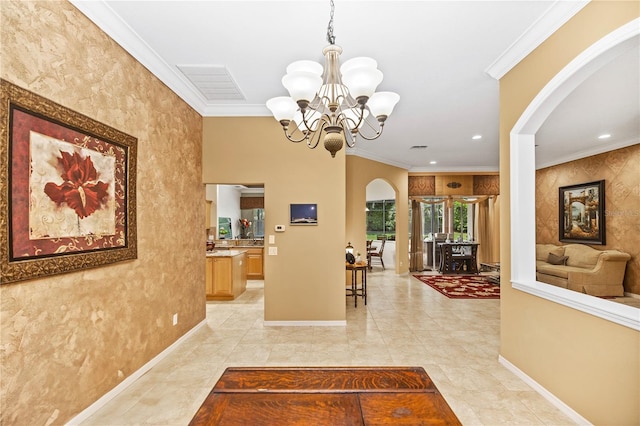 corridor with crown molding and a chandelier