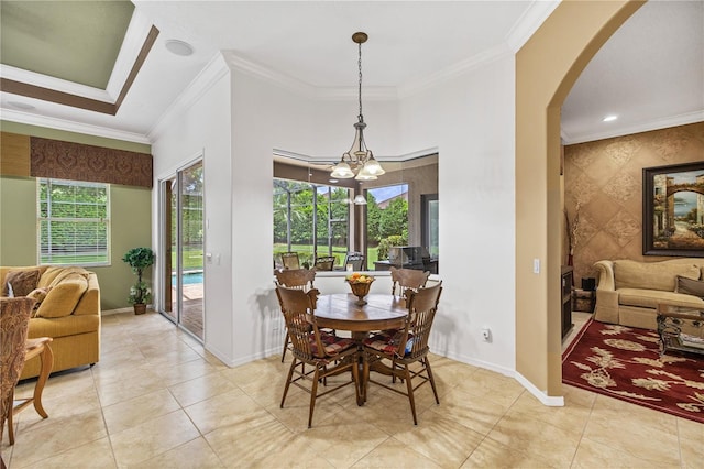 dining area featuring a chandelier, crown molding, and light tile patterned flooring