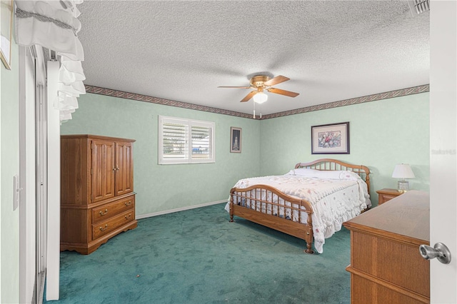 bedroom featuring a textured ceiling, ceiling fan, and carpet floors