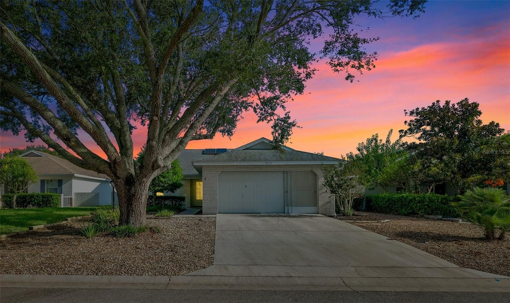 single story home featuring a garage