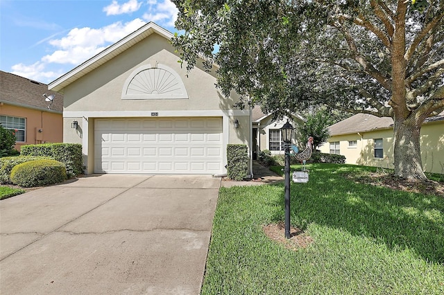 view of front of house featuring a front yard and a garage