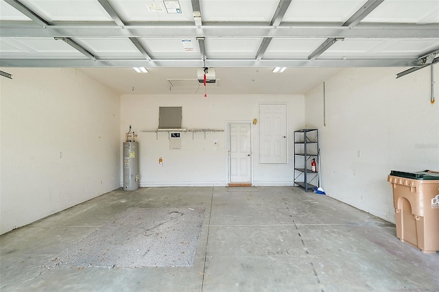 garage featuring electric water heater and a garage door opener